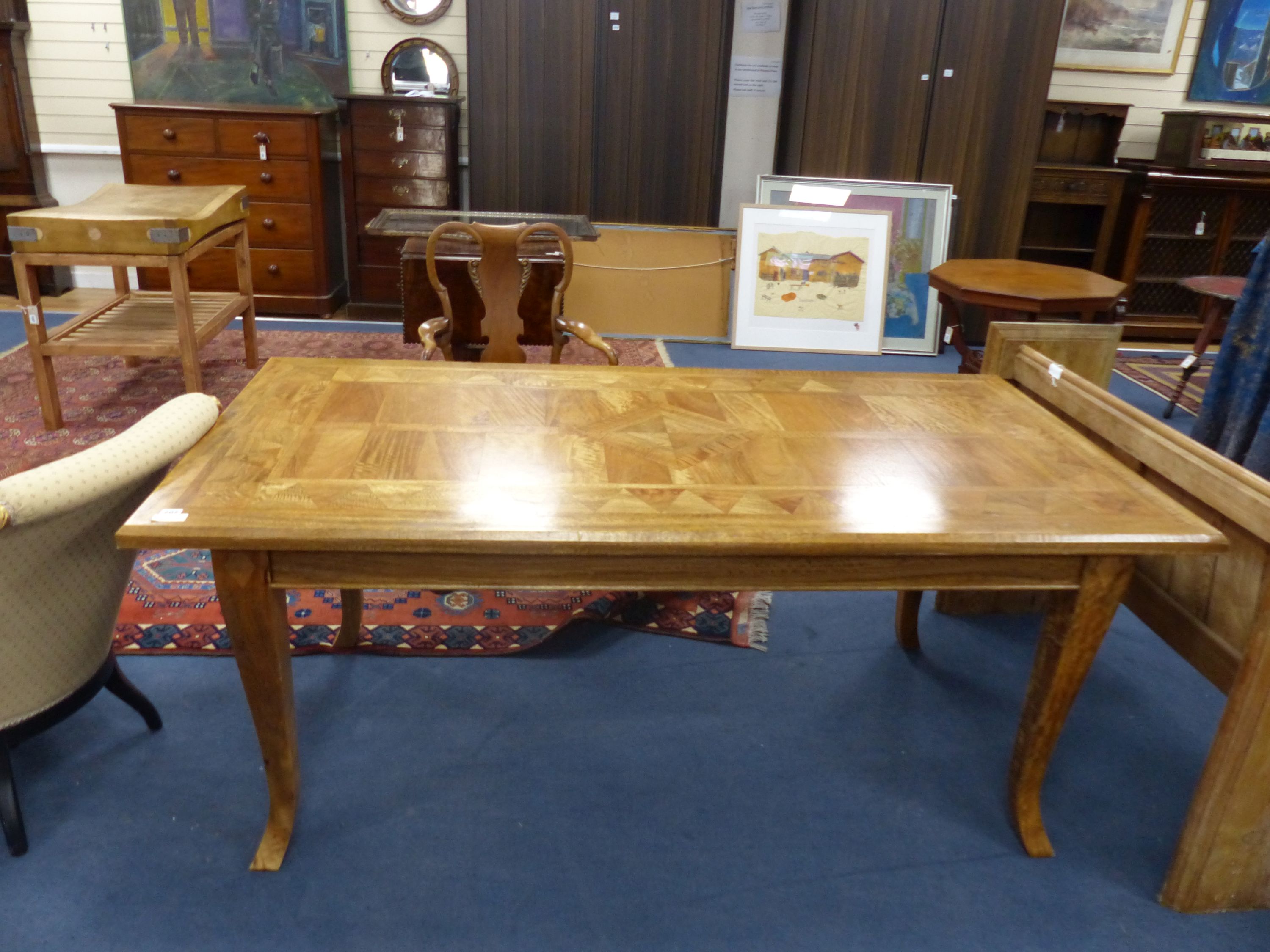 A rectangular Continental parquetry dining table, length 180cm, depth 90cm, height 75cm